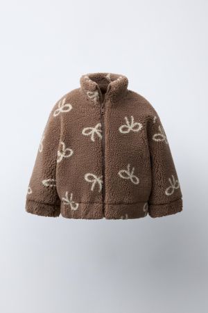 FAUX SHEARLING JACKET WITH BOW PRINT