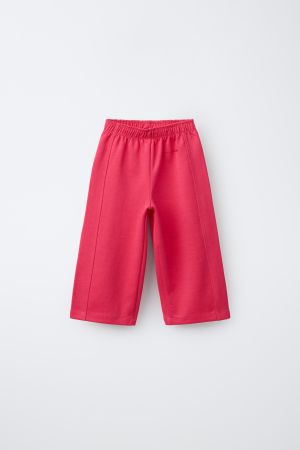 WIDE LEG INTERLOCK RAISED TEXT PANTS
