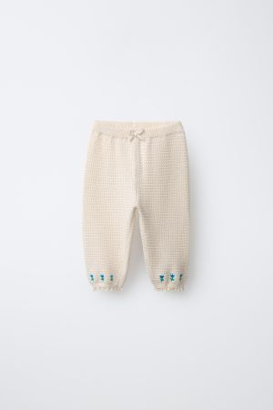 EMBROIDERED FLORAL TEXTURED PANTS WITH LACE TRIM