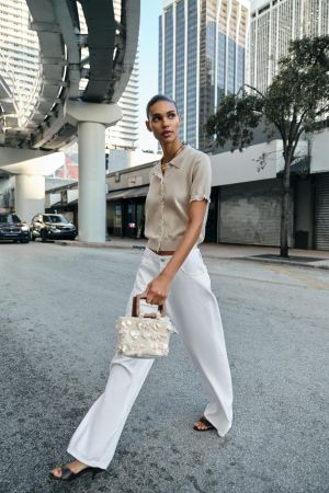 SHORT SLEEVE KNIT JACKET WITH LACE TRIM