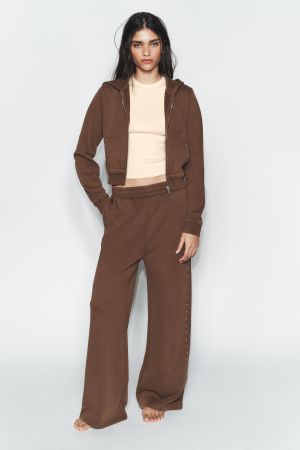 WASHED EFFECT FLEECE PANTS WITH STUDS