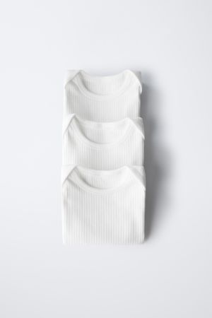 THREE-PACK OF SLEEVELESS BODYSUITS